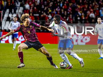 Belgium defender Wout Faes and Italy forward Moise Kean play during the match between Belgium and Italy at the King Baudouin Stadium for the...