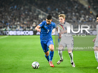 Giorgos Masouras of Greece competes with Anthony Gordon of England during the UEFA Nations League 2024/25 League B, Group B2 match between G...