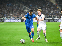 Giorgos Masouras of Greece competes with Anthony Gordon of England during the UEFA Nations League 2024/25 League B, Group B2 match between G...