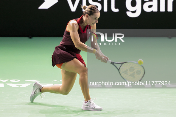 Ana Bogdan of Romania plays backwards during the Billie Jean King Cup match between Japan and Romania at Palacio de los Deportes Martin Carp...