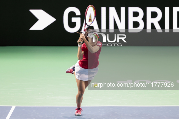 Nao Hibino of Japan plays backwards during the Billie Jean King Cup match between Japan and Romania at Palacio de los Deportes Martin Carpen...