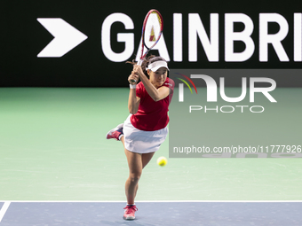 Nao Hibino of Japan plays backwards during the Billie Jean King Cup match between Japan and Romania at Palacio de los Deportes Martin Carpen...