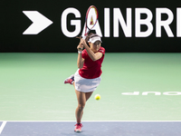 Nao Hibino of Japan plays backwards during the Billie Jean King Cup match between Japan and Romania at Palacio de los Deportes Martin Carpen...