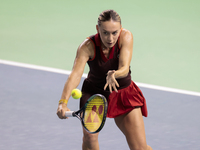 Ana Bogdan of Romania plays backwards during the Billie Jean King Cup match between Japan and Romania at Palacio de los Deportes Martin Carp...