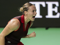 Ana Bogdan of Romania celebrates a point during the Billie Jean King Cup match between Japan and Romania at Palacio de los Deportes Martin C...