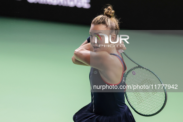 In Malaga, Spain, on November 14, 2024, Jaquesline Cristian of Romania plays a backhand during the Billie Jean King Cup match between Japan...