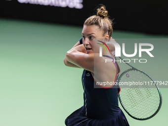 In Malaga, Spain, on November 14, 2024, Jaquesline Cristian of Romania plays a backhand during the Billie Jean King Cup match between Japan...