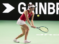 Ena Shibahara of Japan plays backwards during the Billie Jean King Cup match between Japan and Romania at Palacio de los Deportes Martin Car...