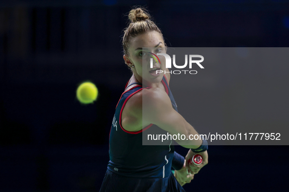 In Malaga, Spain, on November 14, 2024, Jaquesline Cristian of Romania plays a backhand during the Billie Jean King Cup match between Japan...