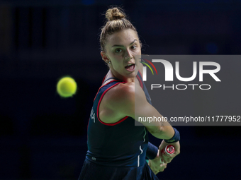 In Malaga, Spain, on November 14, 2024, Jaquesline Cristian of Romania plays a backhand during the Billie Jean King Cup match between Japan...