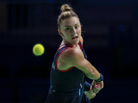 In Malaga, Spain, on November 14, 2024, Jaquesline Cristian of Romania plays a backhand during the Billie Jean King Cup match between Japan...