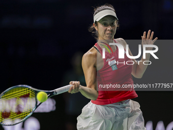 In Malaga, Spain, on November 14, 2024, Ena Shibahara of Japan plays a forehand during the Billie Jean King Cup match between Japan and Roma...