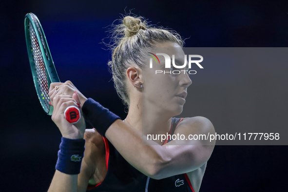 In Malaga, Spain, on November 14, 2024, Jaquesline Cristian of Romania plays a backhand during the Billie Jean King Cup match between Japan...