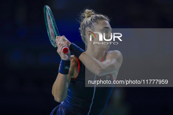 In Malaga, Spain, on November 14, 2024, Jaquesline Cristian of Romania plays a backhand during the Billie Jean King Cup match between Japan...