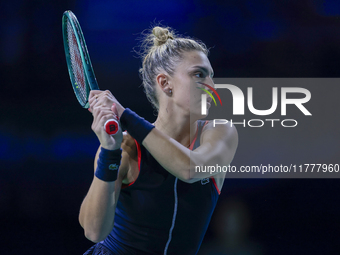 In Malaga, Spain, on November 14, 2024, Jaquesline Cristian of Romania plays a backhand during the Billie Jean King Cup match between Japan...