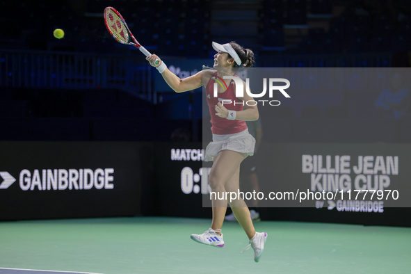 Eri Hozumi of Japan plays a forehand during the Billie Jean King Cup match between Japan and Romania at Palacio de los Deportes Martin Carpe...