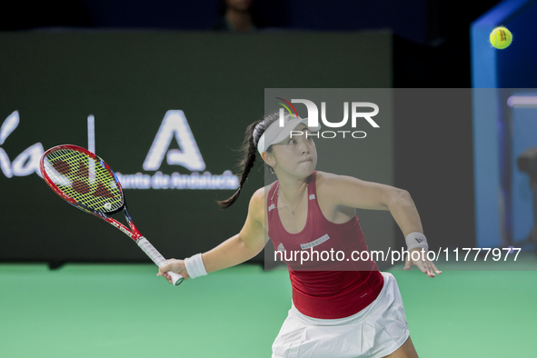 Eri Hozumi of Japan plays a forehand during the Billie Jean King Cup match between Japan and Romania at Palacio de los Deportes Martin Carpe...