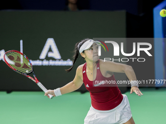 Eri Hozumi of Japan plays a forehand during the Billie Jean King Cup match between Japan and Romania at Palacio de los Deportes Martin Carpe...