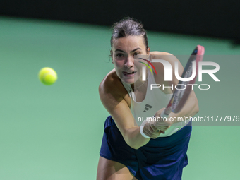 Elena Gabriela Ruse of Romania plays a backhand during the Billie Jean King Cup match between Japan and Romania at Palacio de los Deportes M...