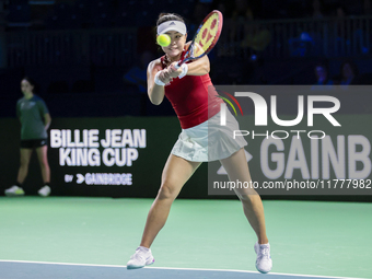 Eri Hozumi of Japan plays backwards during the Billie Jean King Cup match between Japan and Romania at Palacio de los Deportes Martin Carpen...