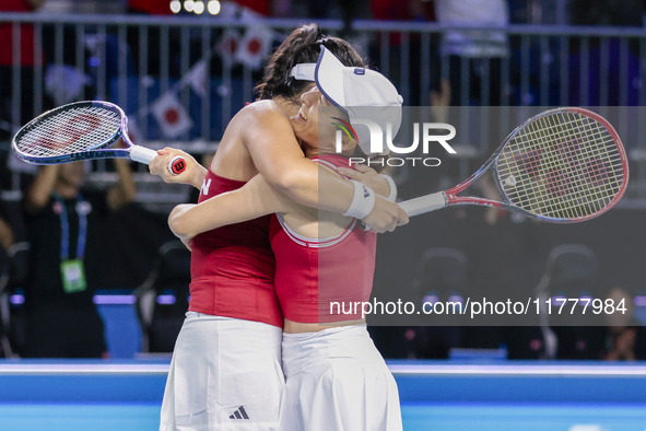 Shuko Aoyama of Japan and Eri Hozumi of Japan celebrate the victory during the Billie Jean King Cup match between Japan and Romania at Palac...