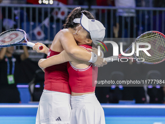 Shuko Aoyama of Japan and Eri Hozumi of Japan celebrate the victory during the Billie Jean King Cup match between Japan and Romania at Palac...