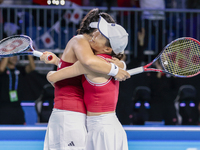 Shuko Aoyama of Japan and Eri Hozumi of Japan celebrate the victory during the Billie Jean King Cup match between Japan and Romania at Palac...