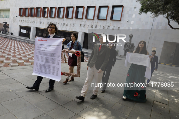 Pro-Palestine activists in Mexico City, Mexico, on November 14, 2024, demonstrate outside the Ministry of Foreign Affairs, demanding that Cl...