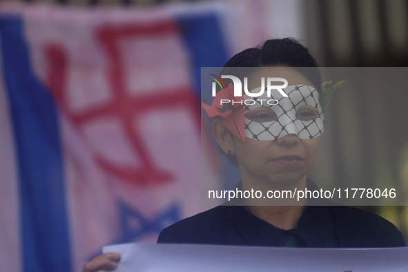 Pro-Palestine activists in Mexico City, Mexico, on November 14, 2024, demonstrate outside the Memory and Tolerance Museum, where they demand...