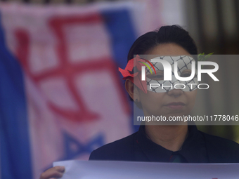 Pro-Palestine activists in Mexico City, Mexico, on November 14, 2024, demonstrate outside the Memory and Tolerance Museum, where they demand...