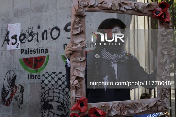 Pro-Palestine activists in Mexico City, Mexico, on November 14, 2024, demonstrate outside the Memory and Tolerance Museum, where they demand...