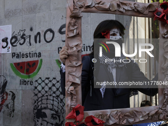 Pro-Palestine activists in Mexico City, Mexico, on November 14, 2024, demonstrate outside the Memory and Tolerance Museum, where they demand...