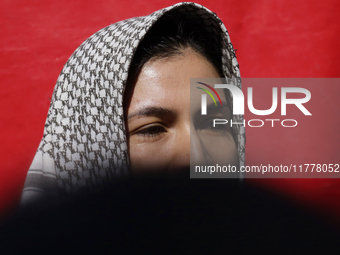 A pro-Palestine activist stands in Mexico City, Mexico, outside the Ministry of Foreign Affairs, where more people demand that Claudia Shein...