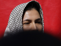 A pro-Palestine activist stands in Mexico City, Mexico, outside the Ministry of Foreign Affairs, where more people demand that Claudia Shein...