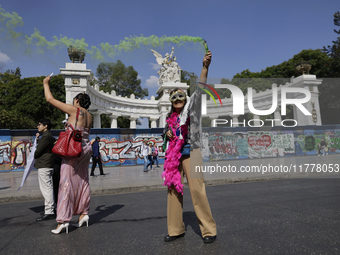 A pro-Palestine activist stands in Mexico City, Mexico, outside the Ministry of Foreign Affairs, where more people demand that Claudia Shein...