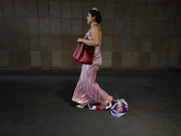 A pro-Palestine activist in Mexico City, Mexico, drags an Israeli flag outside the Ministry of Foreign Affairs, where more people demand tha...