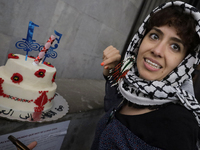 A pro-Palestine activist in Mexico City, Mexico, demonstrates outside the Ministry of Foreign Affairs, where more people demand that Claudia...