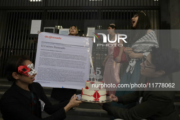 Pro-Palestine activists in Mexico City, Mexico, on November 14, 2024, carry a cake and demonstrate outside the Ministry of Foreign Affairs,...