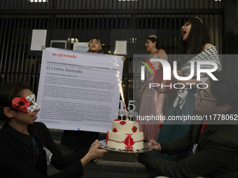 Pro-Palestine activists in Mexico City, Mexico, on November 14, 2024, carry a cake and demonstrate outside the Ministry of Foreign Affairs,...