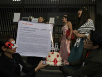 Pro-Palestine activists in Mexico City, Mexico, on November 14, 2024, carry a cake and demonstrate outside the Ministry of Foreign Affairs,...