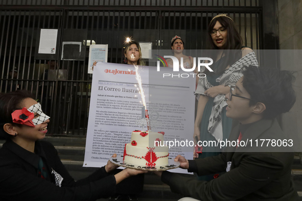 Pro-Palestine activists in Mexico City, Mexico, on November 14, 2024, carry a cake and demonstrate outside the Ministry of Foreign Affairs,...