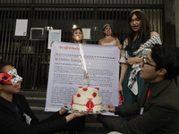 Pro-Palestine activists in Mexico City, Mexico, on November 14, 2024, carry a cake and demonstrate outside the Ministry of Foreign Affairs,...