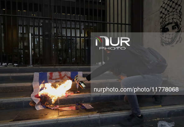 Pro-Palestinian activists in Mexico City, Mexico, on November 14, 2024, burn an Israeli flag outside the Ministry of Foreign Affairs, where...