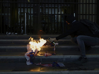 Pro-Palestinian activists in Mexico City, Mexico, on November 14, 2024, burn an Israeli flag outside the Ministry of Foreign Affairs, where...