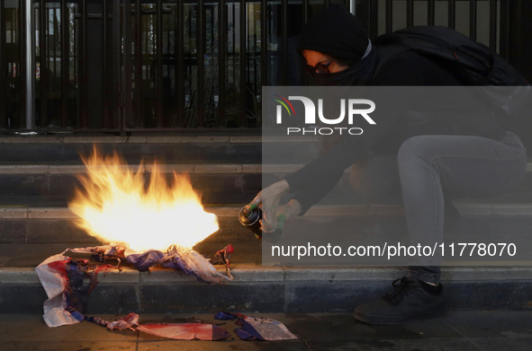 Pro-Palestinian activists in Mexico City, Mexico, on November 14, 2024, burn an Israeli flag outside the Ministry of Foreign Affairs, where...