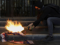 Pro-Palestinian activists in Mexico City, Mexico, on November 14, 2024, burn an Israeli flag outside the Ministry of Foreign Affairs, where...