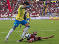 Jose Andres Martinez of Venezuela competes for the ball with Igor Jesus of Brazil during a 2026 FIFA World Cup qualifier at the Monumental s...