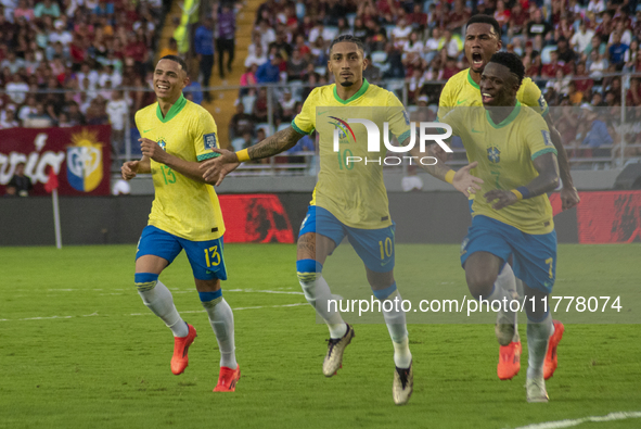 Brazilian national team players celebrate after scoring a goal during the 2026 FIFA World Cup qualifier against Venezuela at the Monumental...