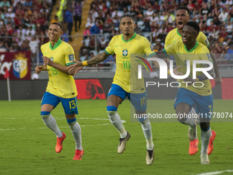 Brazilian national team players celebrate after scoring a goal during the 2026 FIFA World Cup qualifier against Venezuela at the Monumental...