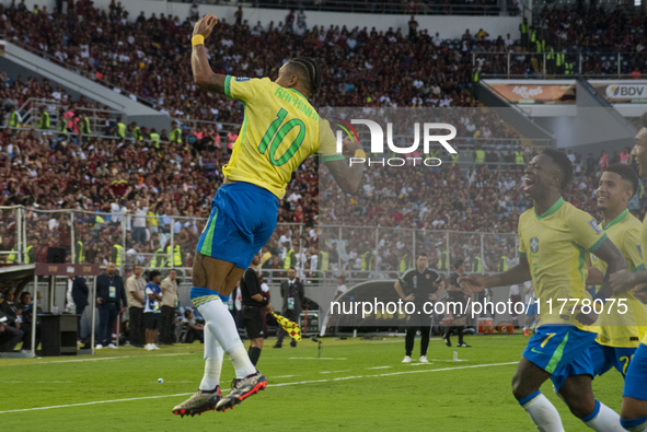 Brazilian national team players celebrate after scoring a goal during the 2026 FIFA World Cup qualifier against Venezuela at the Monumental...